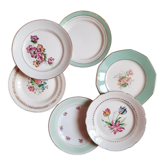 Flat antique earthenware plates with gilded edges