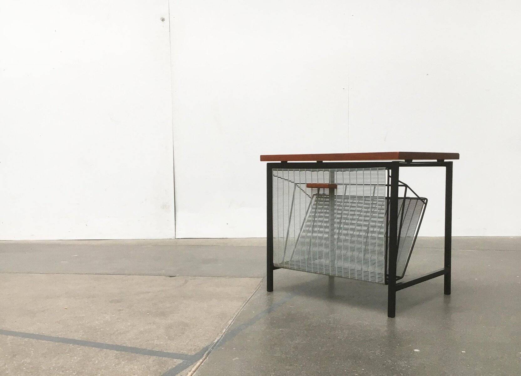 Mid-century teak side table with magazine rack.