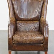 Fauteuil en cuir de vachette grainé au design intemporel