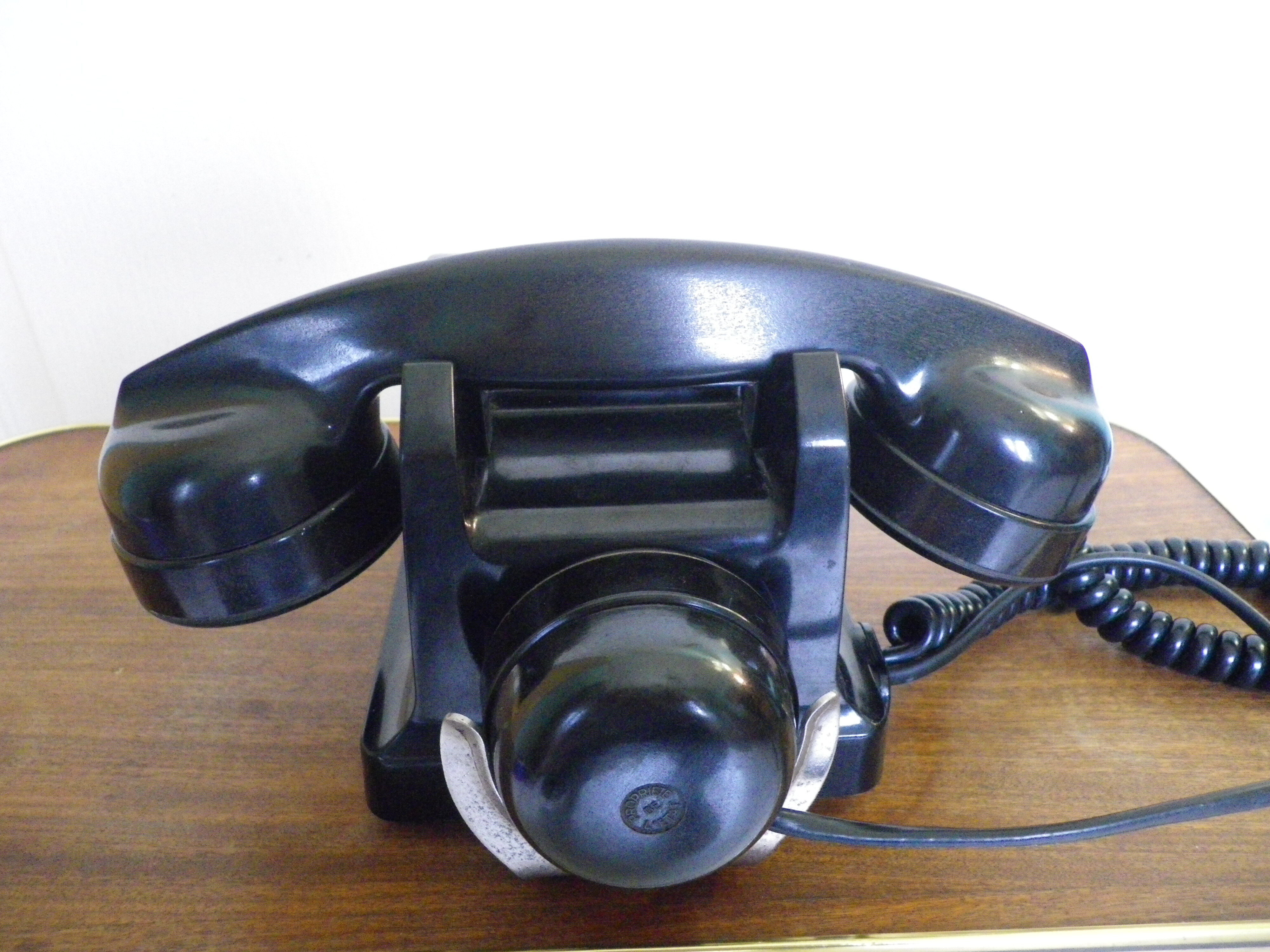 Black bakelite phone with earphone