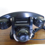 Black bakelite phone with earphone
