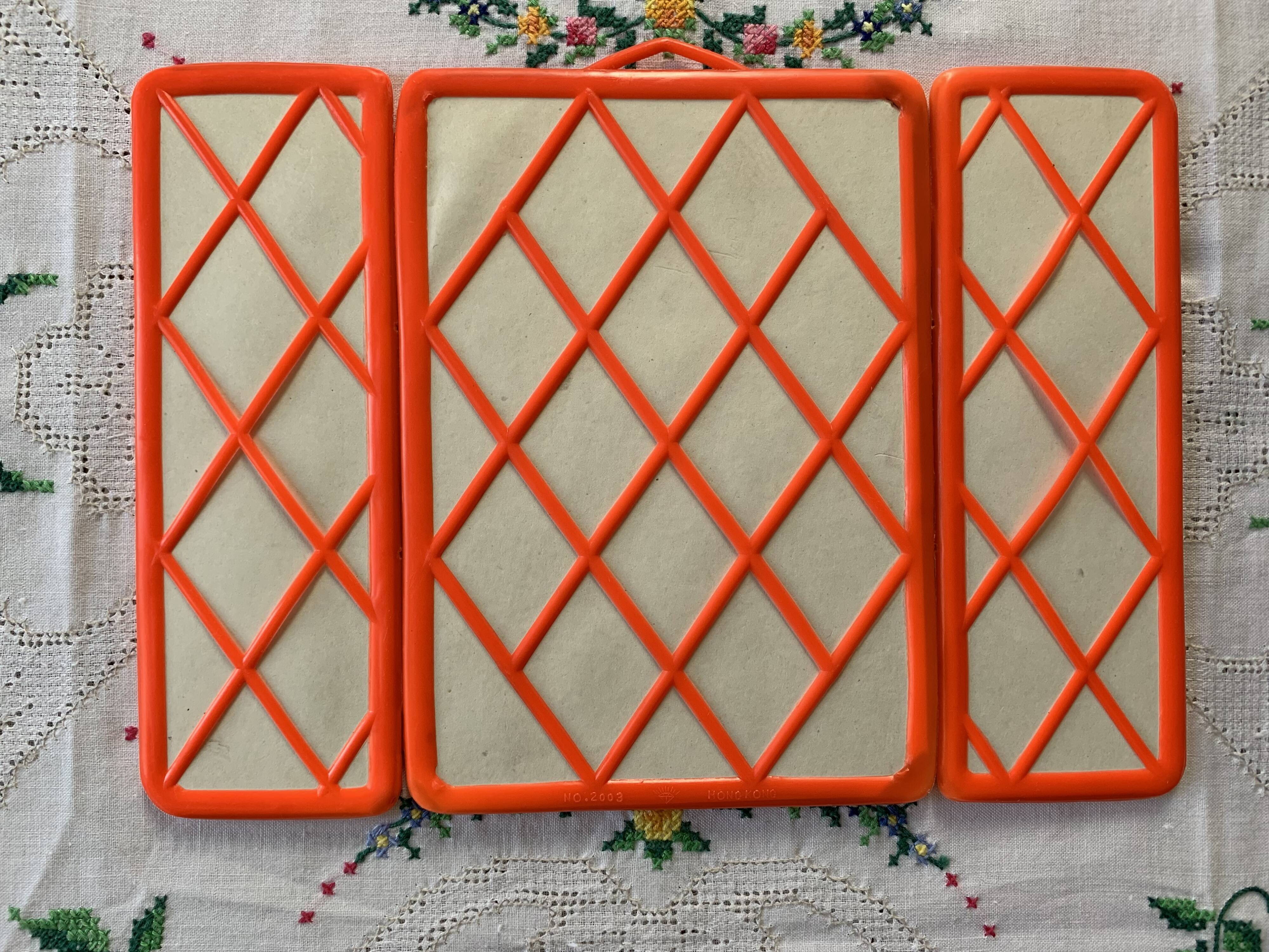 Orange plastic triptych mirror