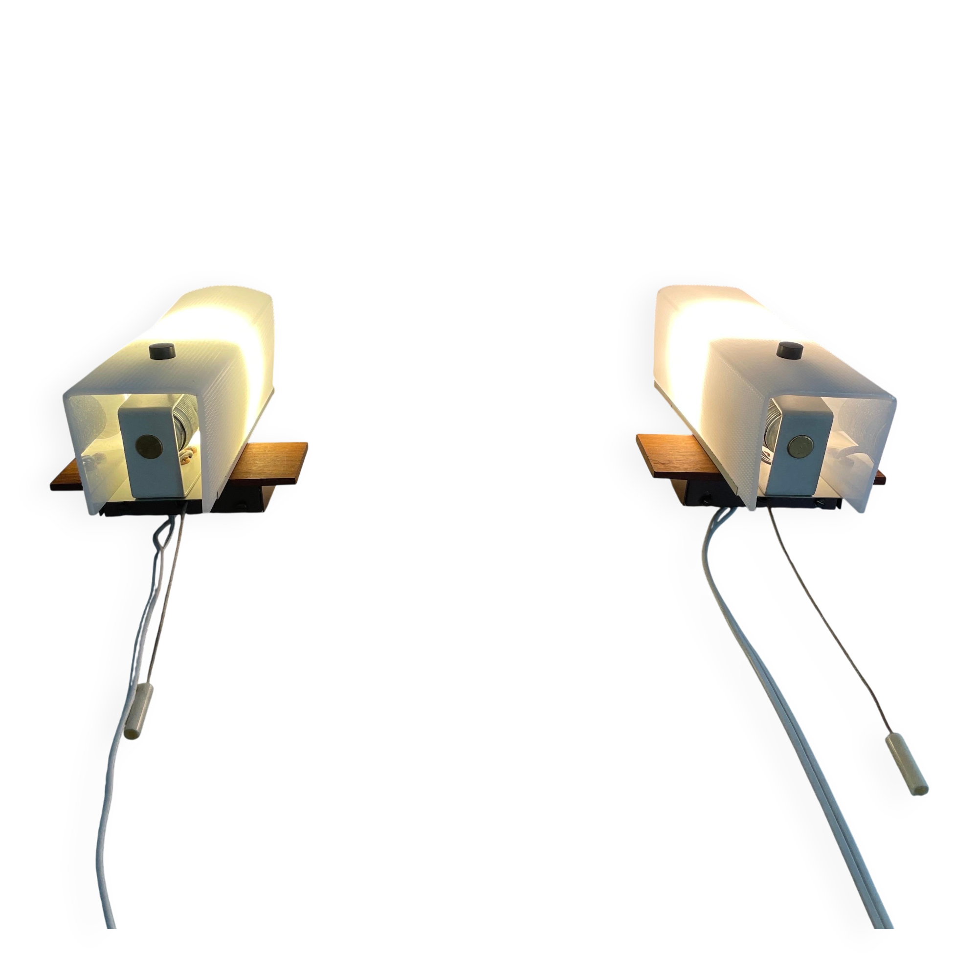 Mid-century wall lights in white plexiglass with a wooden base, 1960s, Germany.