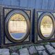 Pair of antique mirrors from the Napoléon III period, black and gilded.
