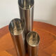 Vintage trio of brushed stainless steel candle holders