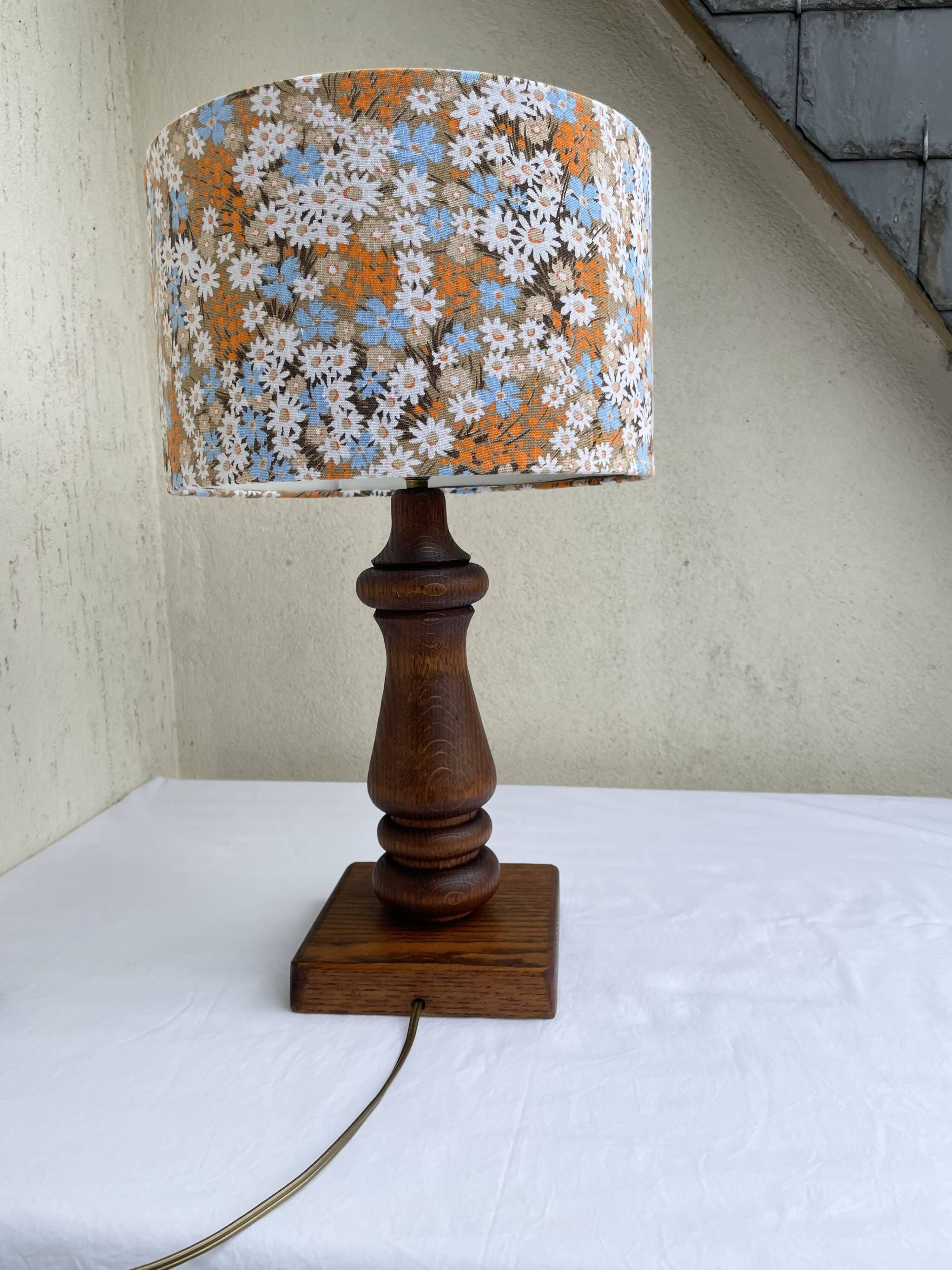 Vintage turned wood table lamp with floral drum shade.