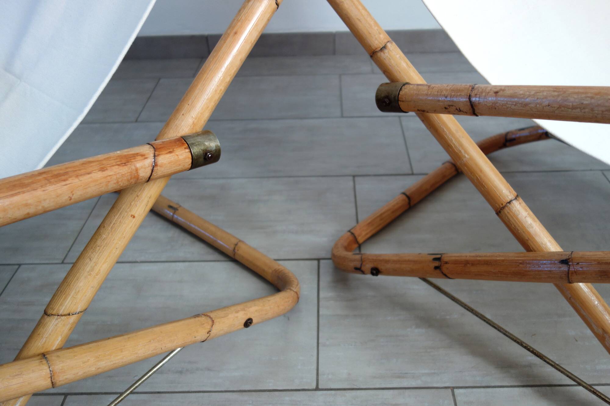 Pair of folding bamboo and brass deck chairs, Italy, 1960s.