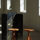 Pair of Scandinavian oak side tables with central legs and sculptural curved feet, 1960s.