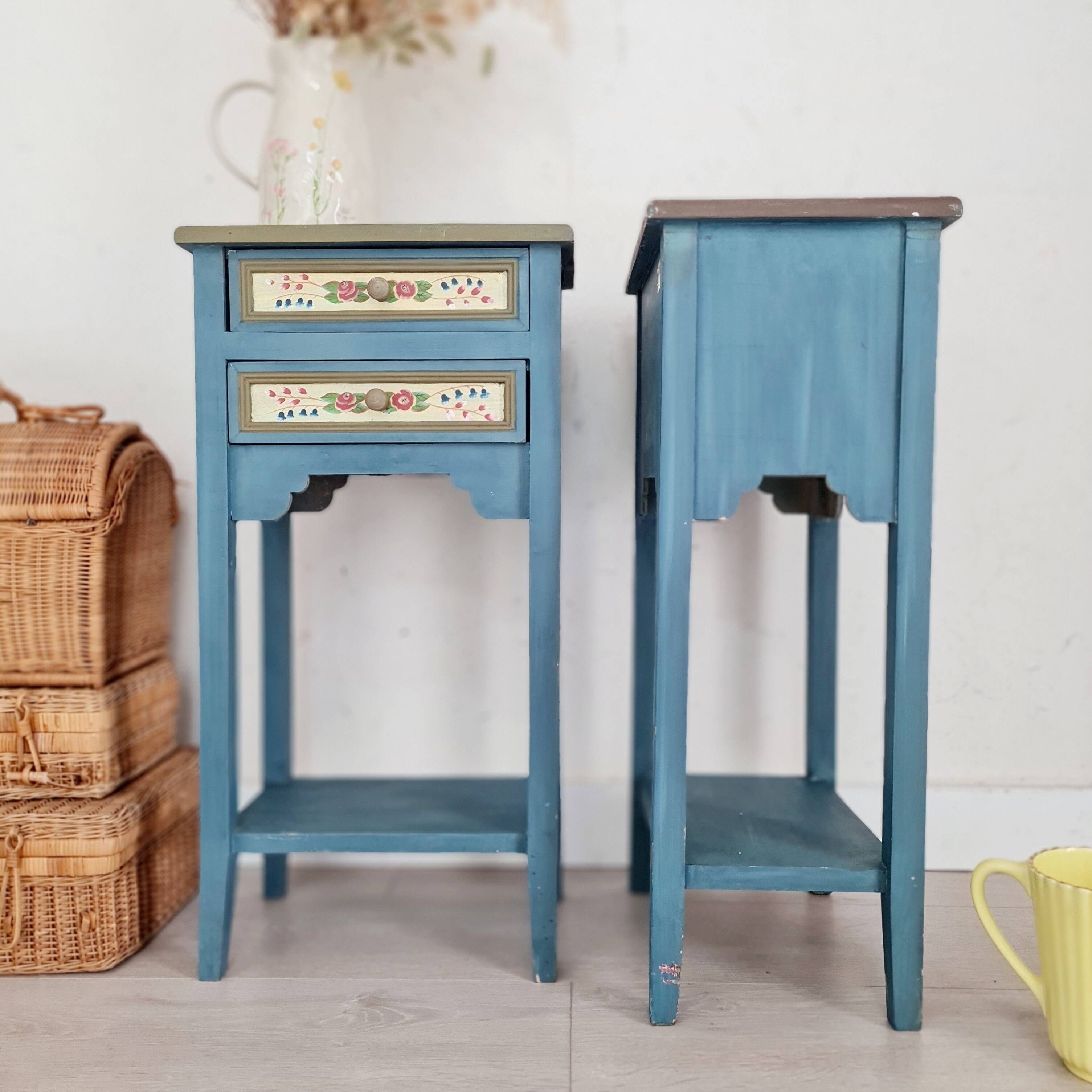 Blue wooden bedside tables with floral patterns