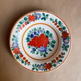 Floral decorative plate and bunch of grapes from eastern countries