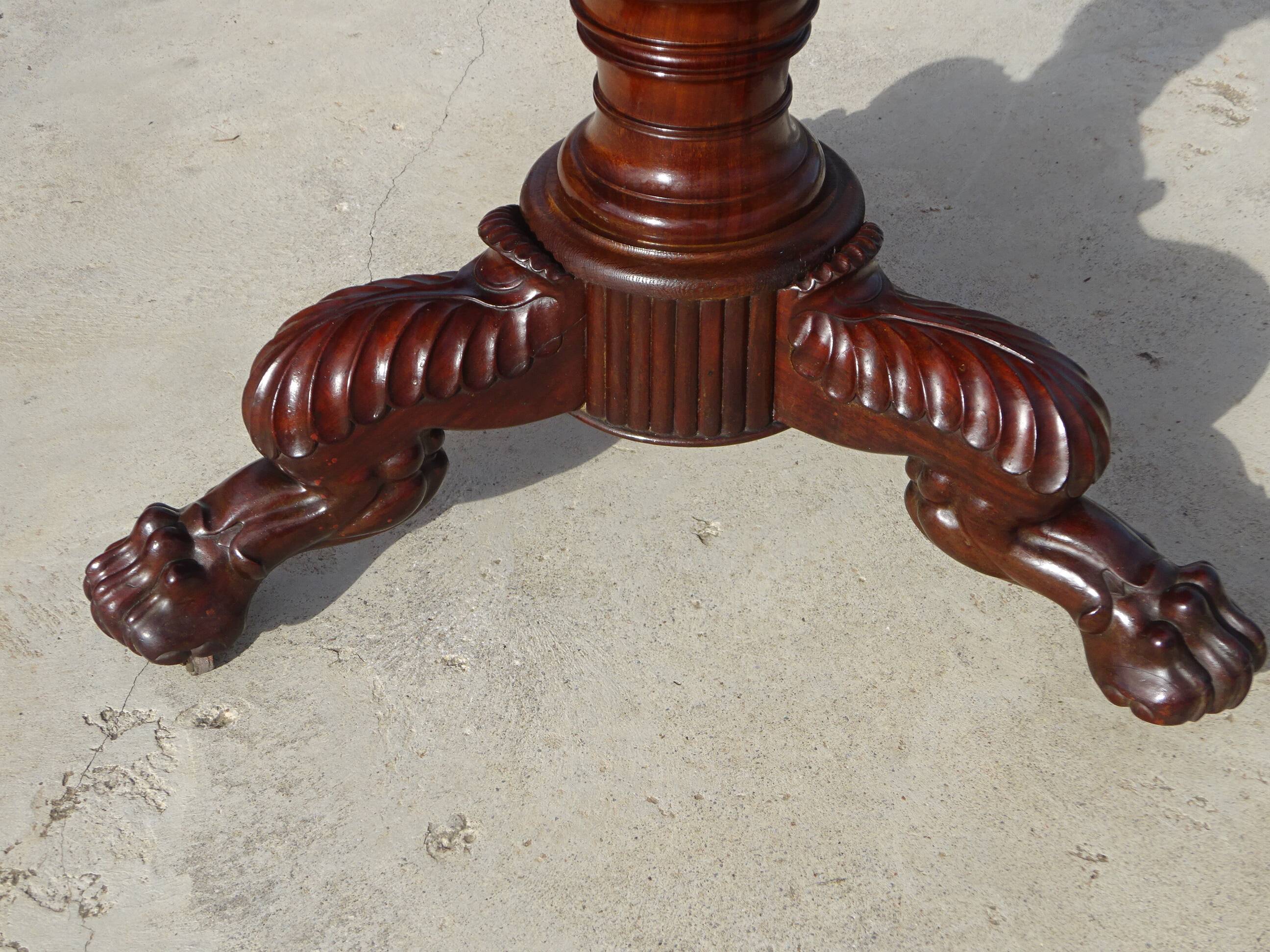 Empire guéridon in mahogany and marble, revolving top.