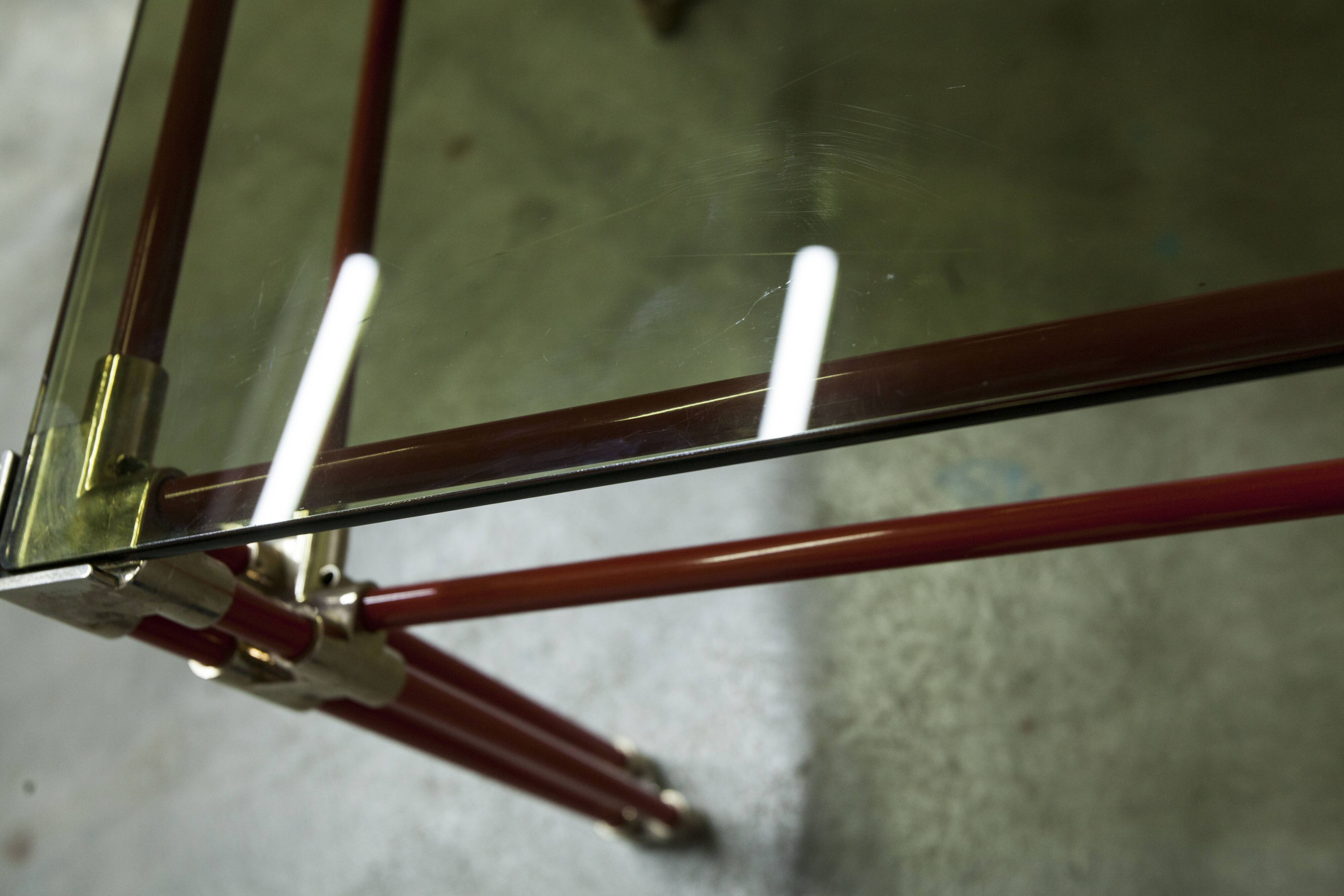 Postmodern Italian design coffee table in smoked glass with red steel structure