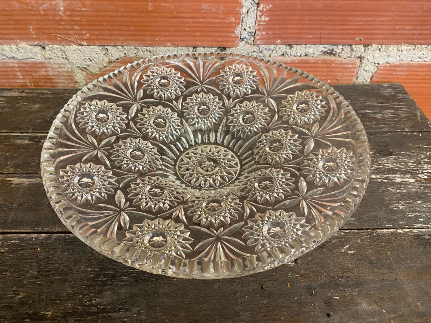 Cut glass fruit bowl with carved star decoration.