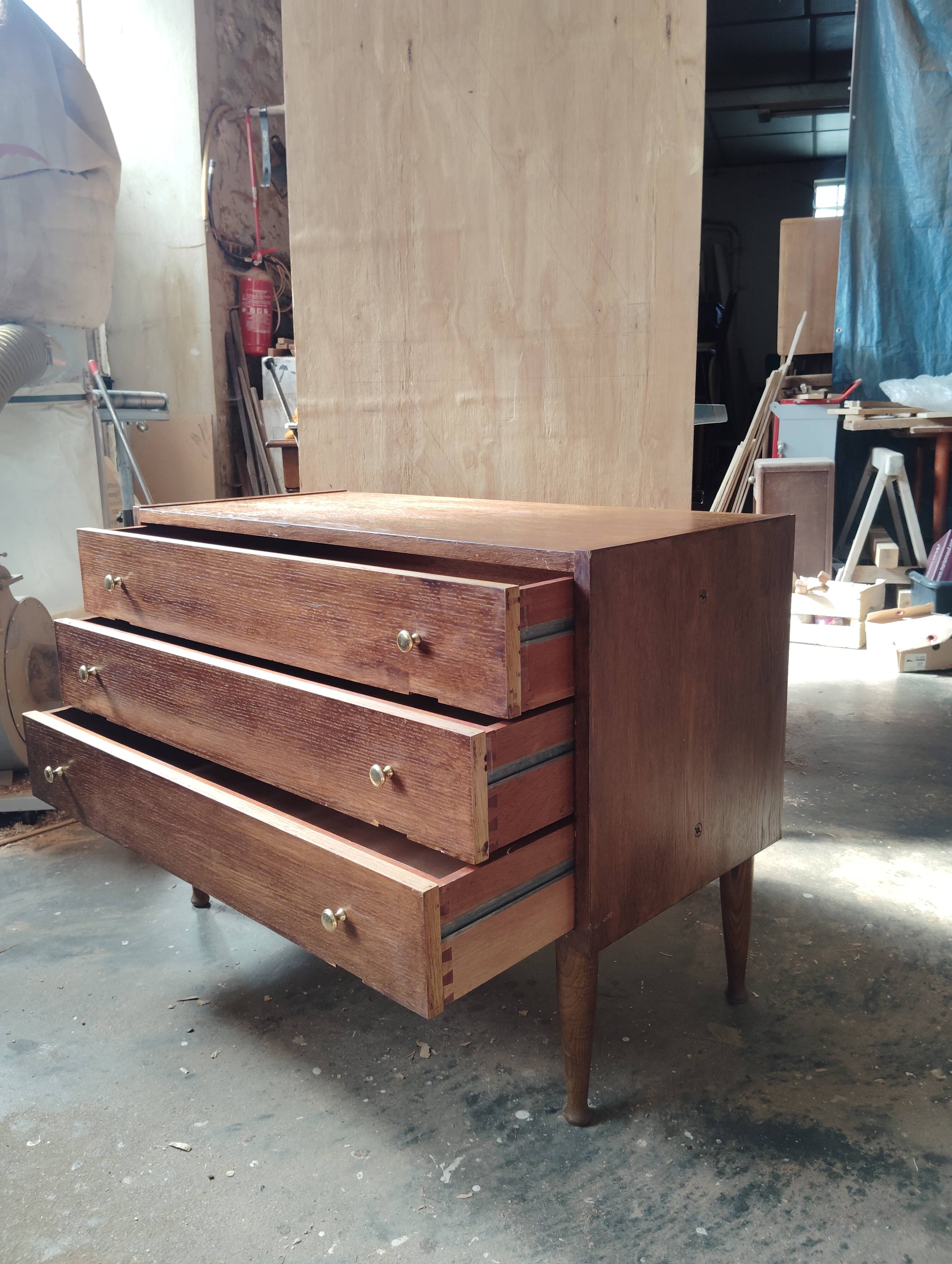 Vintage commode with tapered legs.