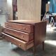 Vintage commode with tapered legs.