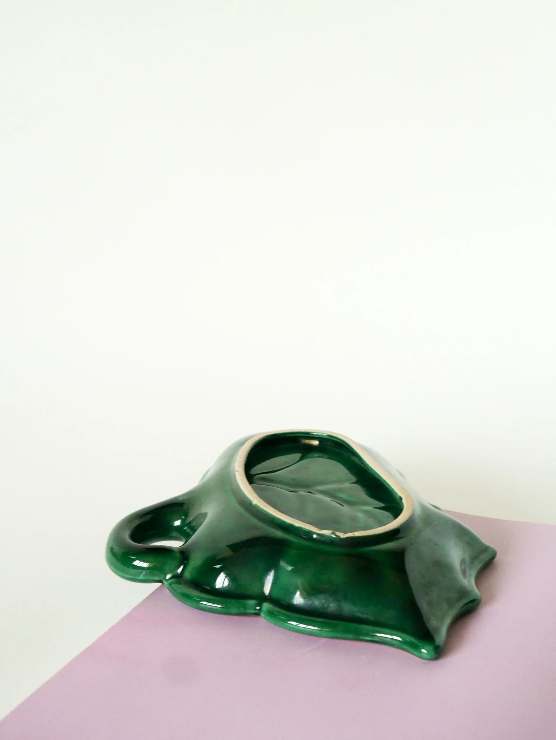 Leaf-shaped earthenware catchall, green and gold, 1970.