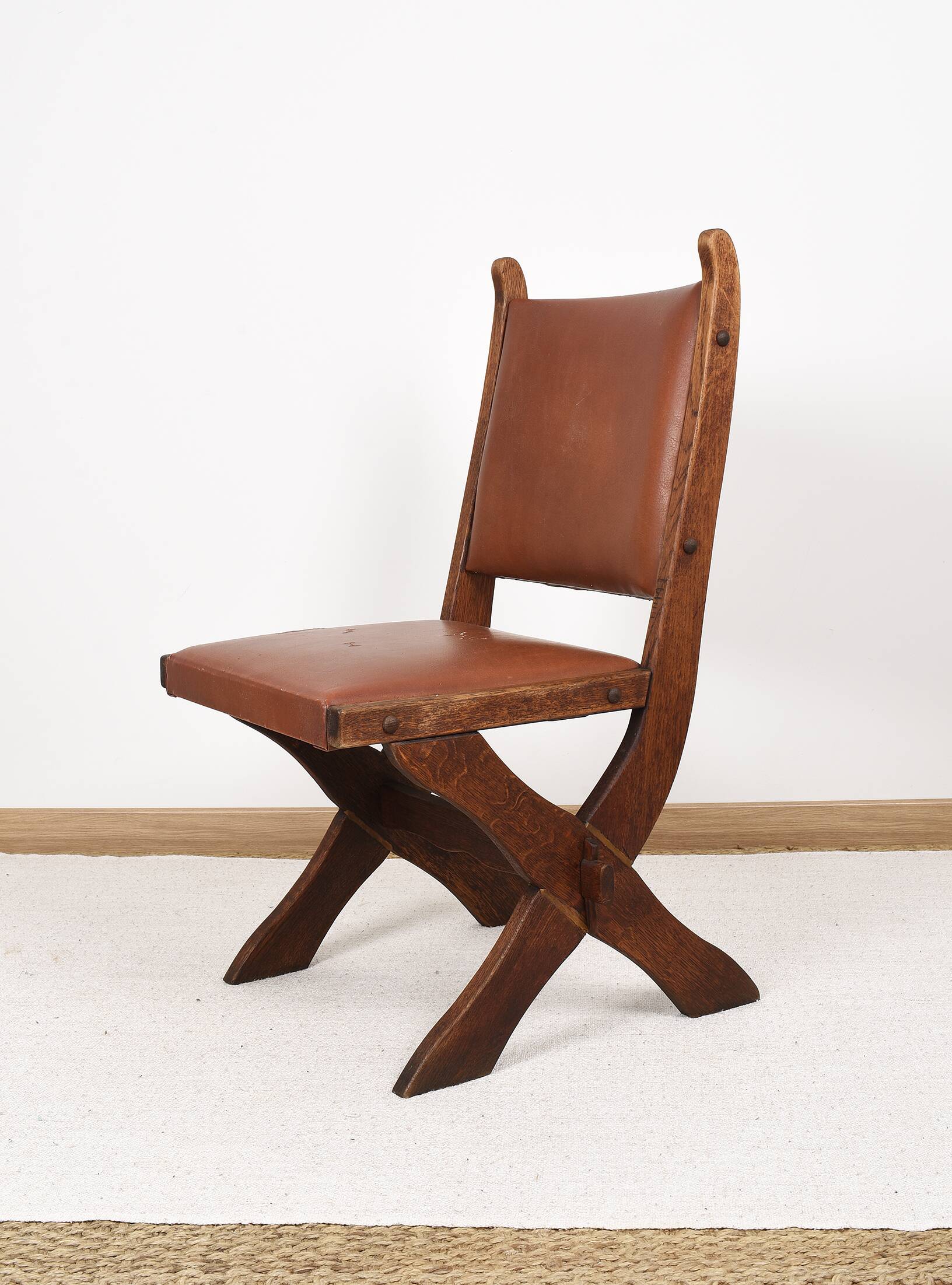 Pair of brutalist style chairs, in wood and leather.
