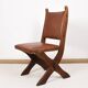 Pair of brutalist style chairs, in wood and leather.