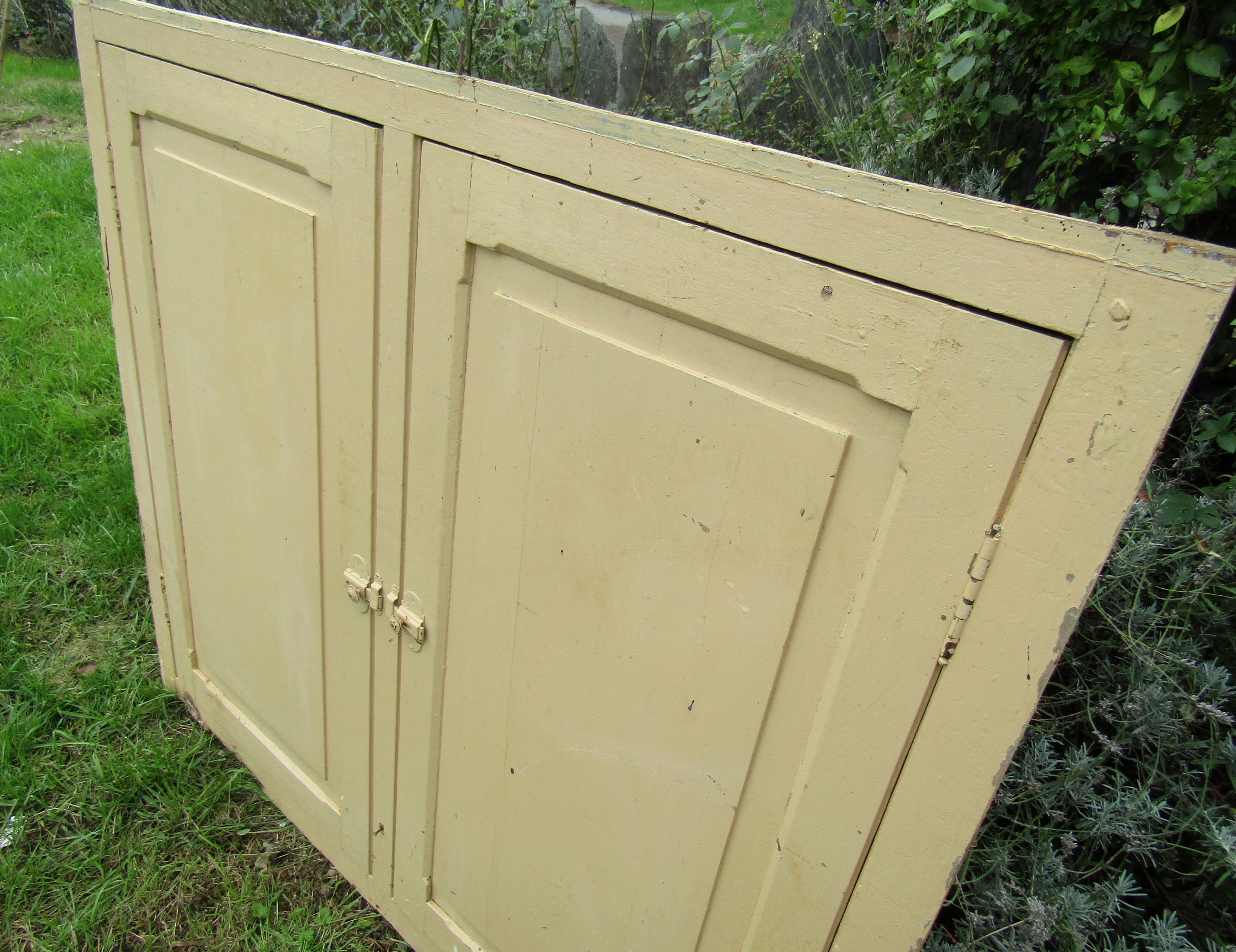 old façade of beige cupboards