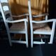 2 armchairs by the fireplace