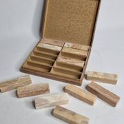 Set of 12 veined onyx knife rests, original box from the 1970s.