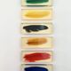 Six feather-shaped knife rests in resin inclusion.