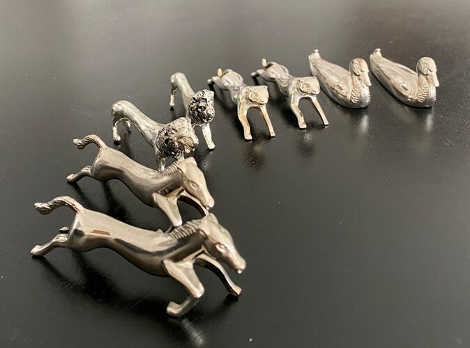 8 porte-couteaux animaux divers en métal argenté