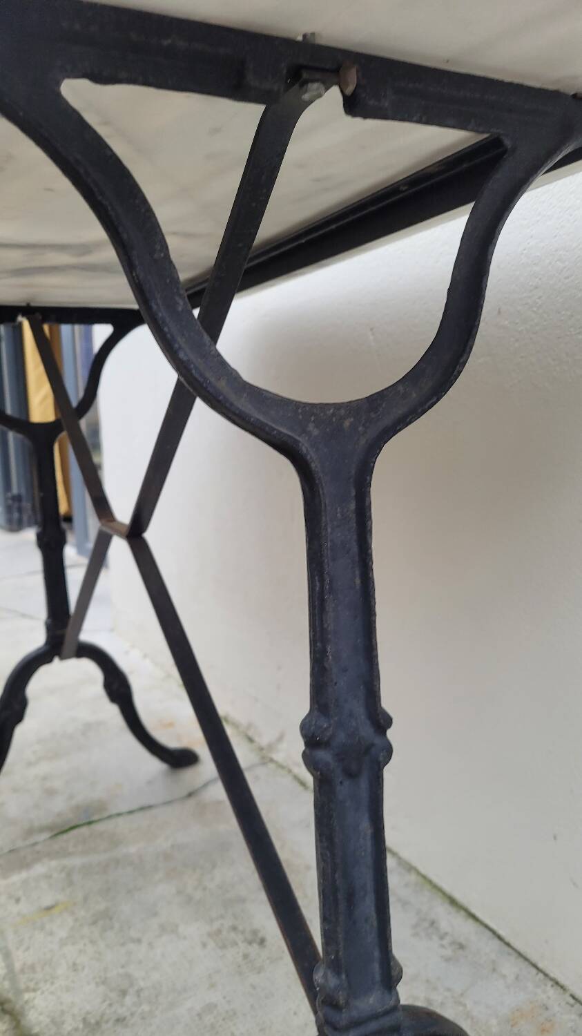 Antique cast iron bistro table with oval marble top