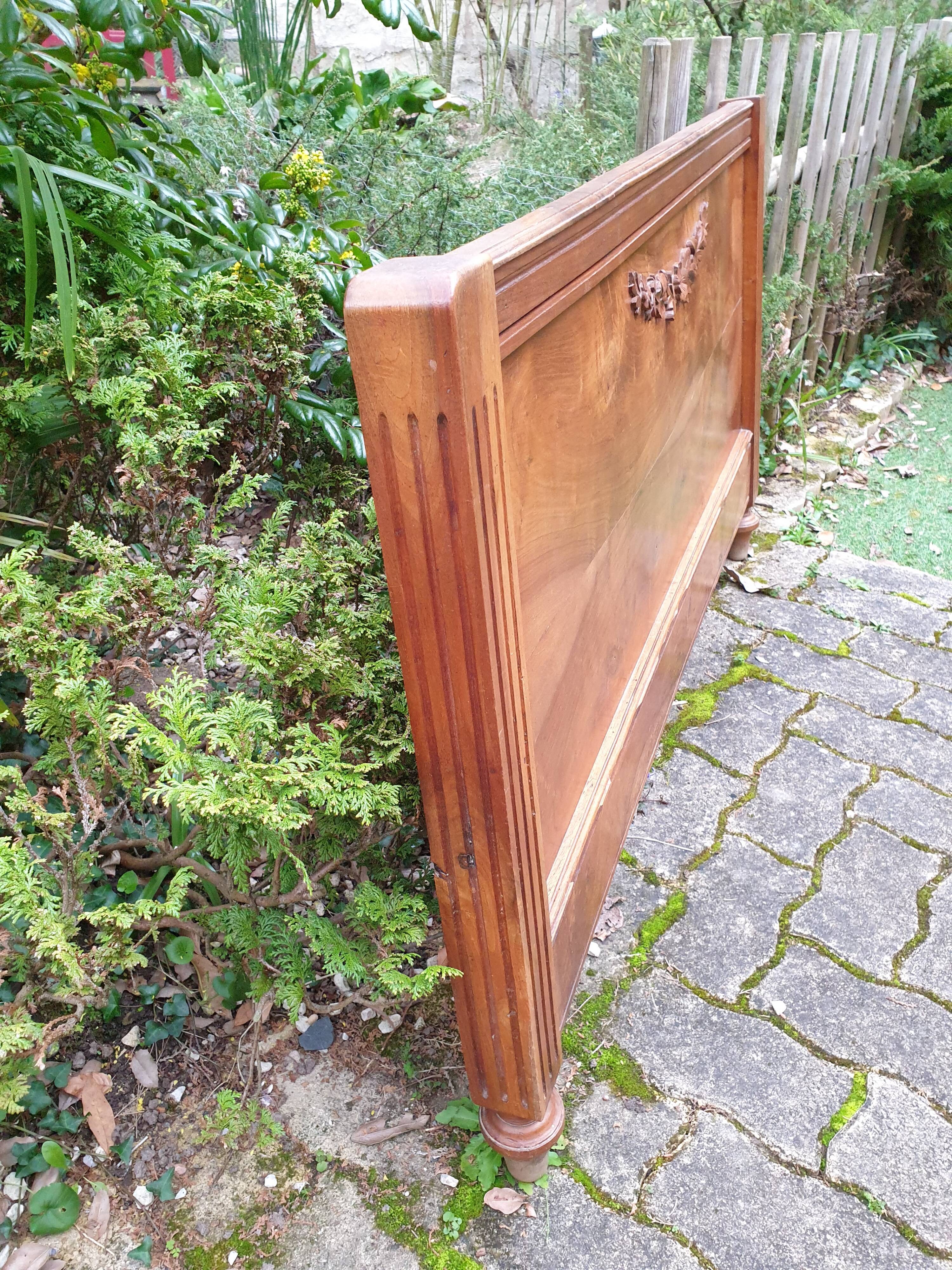 Carved walnut headboard