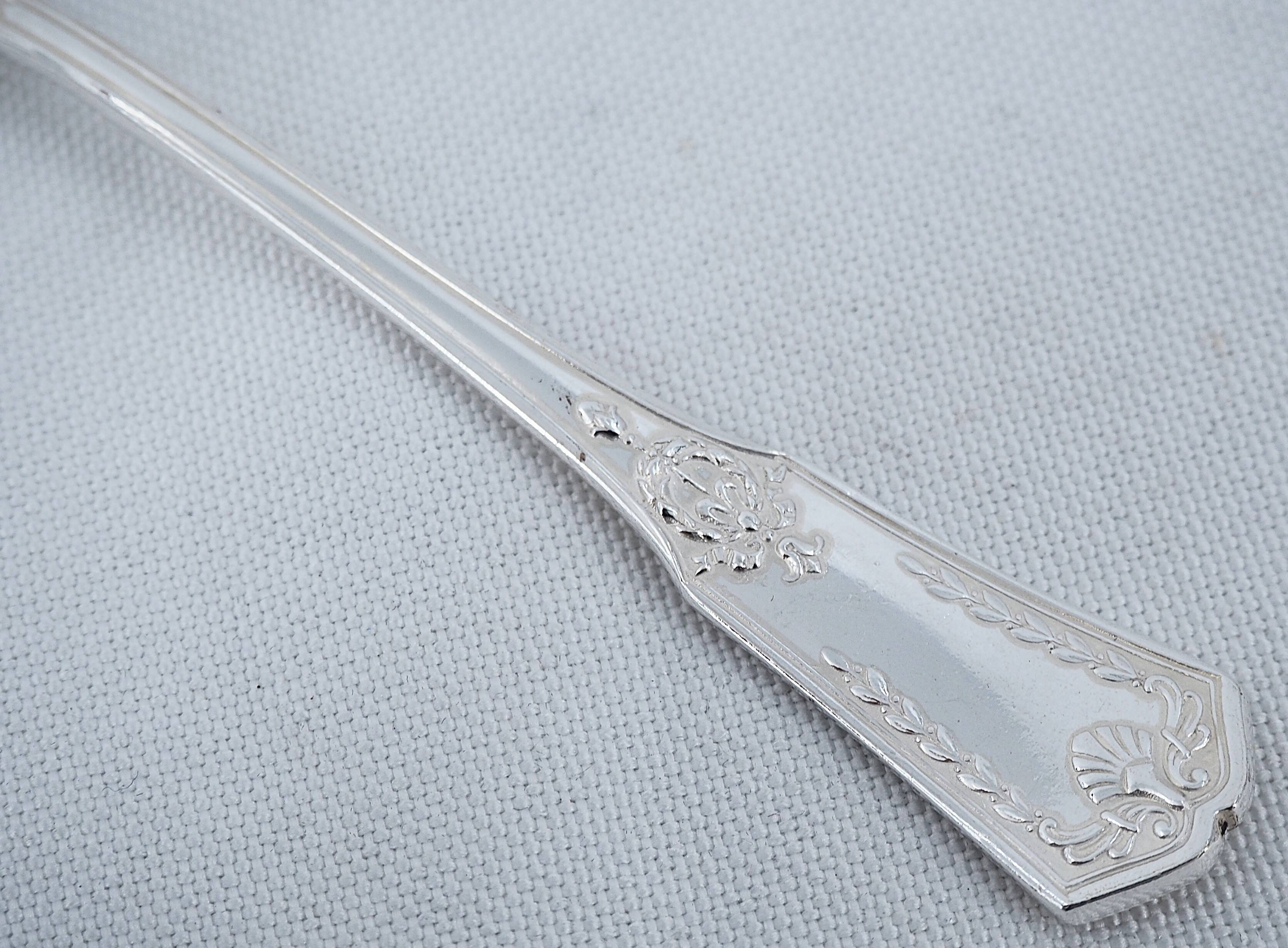 Sfam Empire Without Restraint, 12 snail forks, seafood in silver-plated metal.