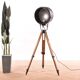 Old industrial spot on wooden tripod floor lamp