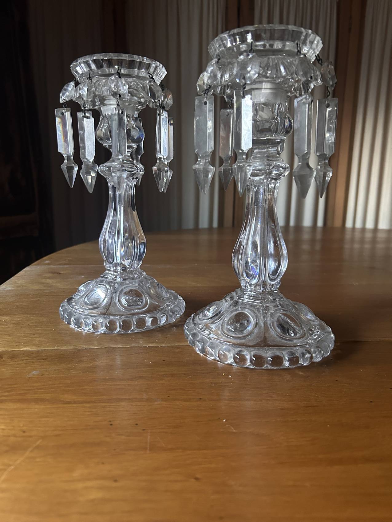 Pair of large Baccarat crystal candlesticks with pendants, a rare choice.