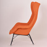 Orange Mid Century Modern armchair, made in 1960s Czechia