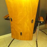 Chairs in leather, walnut and chrome