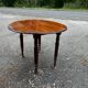 Antique round mahogany table, turned and fluted legs