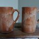 Enamelled stoneware mugs