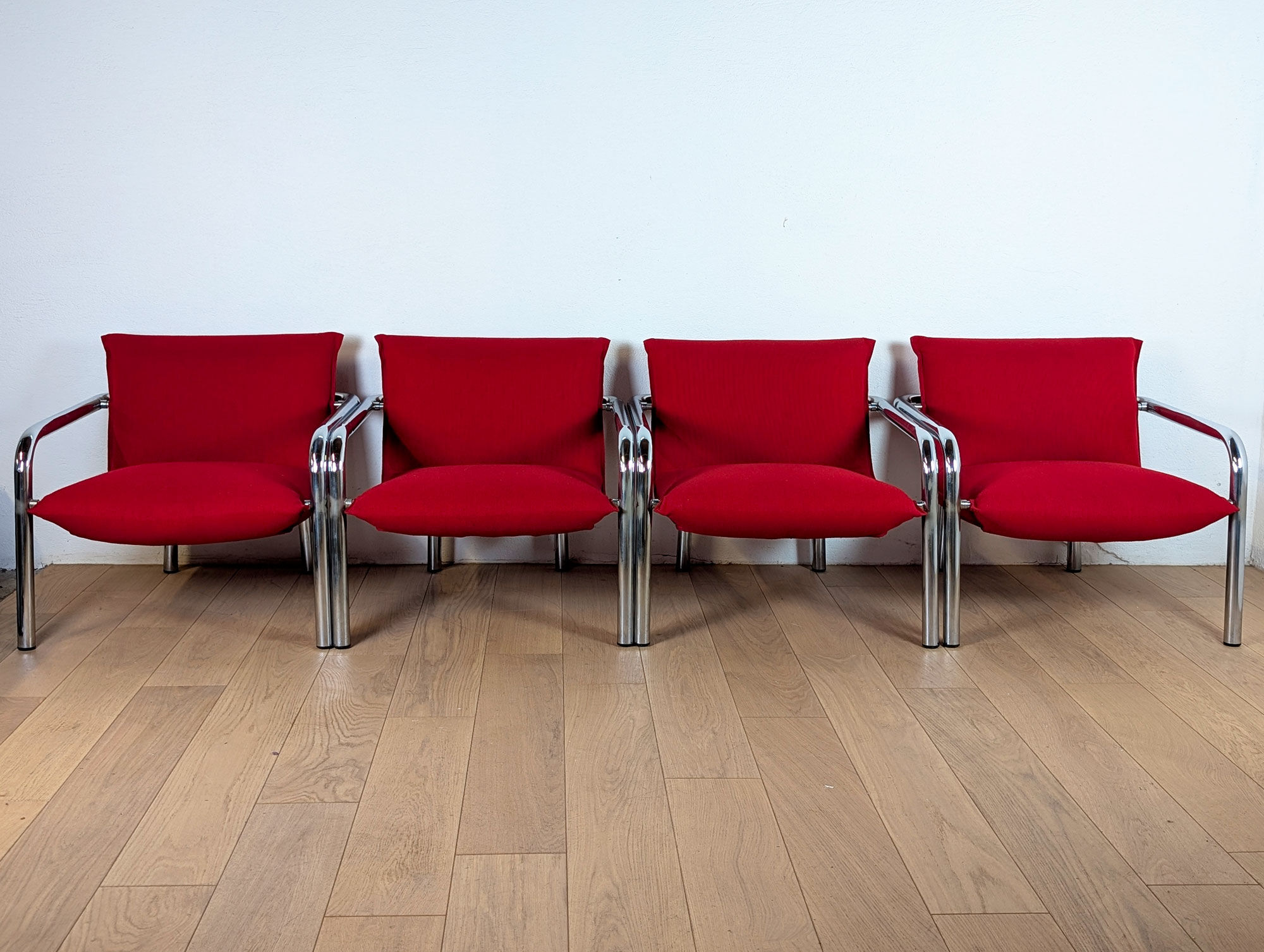 Pair of Italian armchairs in chromed metal and red fabric, 1970