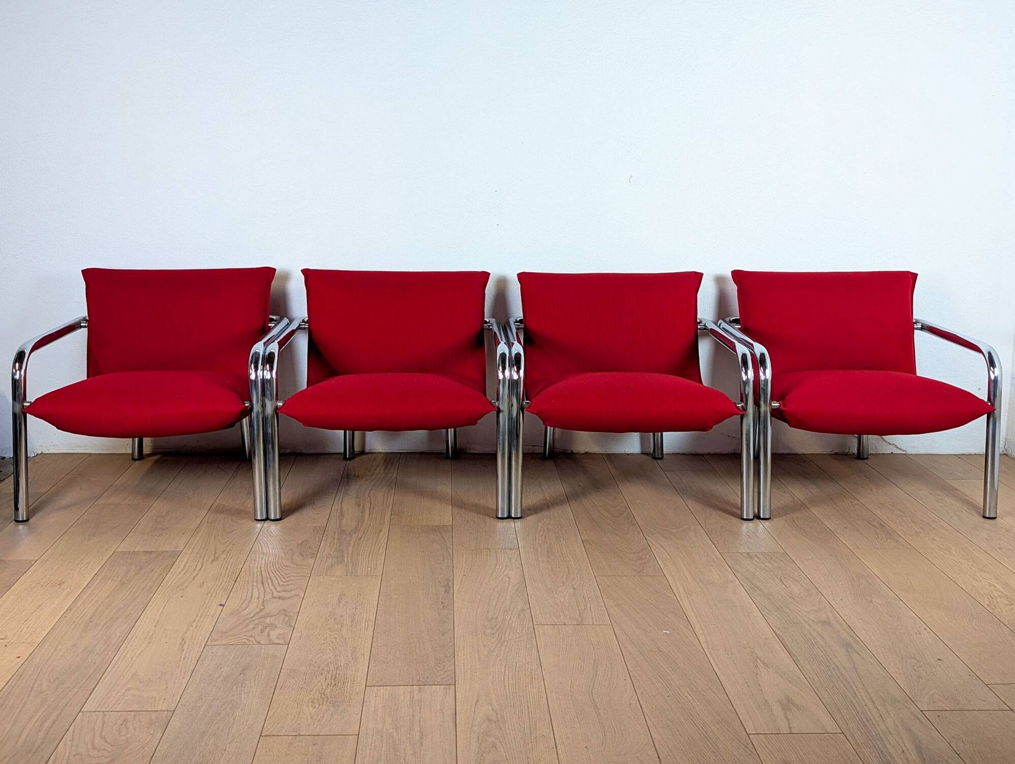 Pair of Italian armchairs in chromed metal and red fabric, 1970