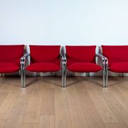 Pair of Italian armchairs in chromed metal and red fabric, 1970