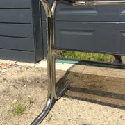 Dining table of the 70s in smoked glass and chromed metal