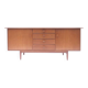 Vintage Scandinavian sideboard with an overflowing top.