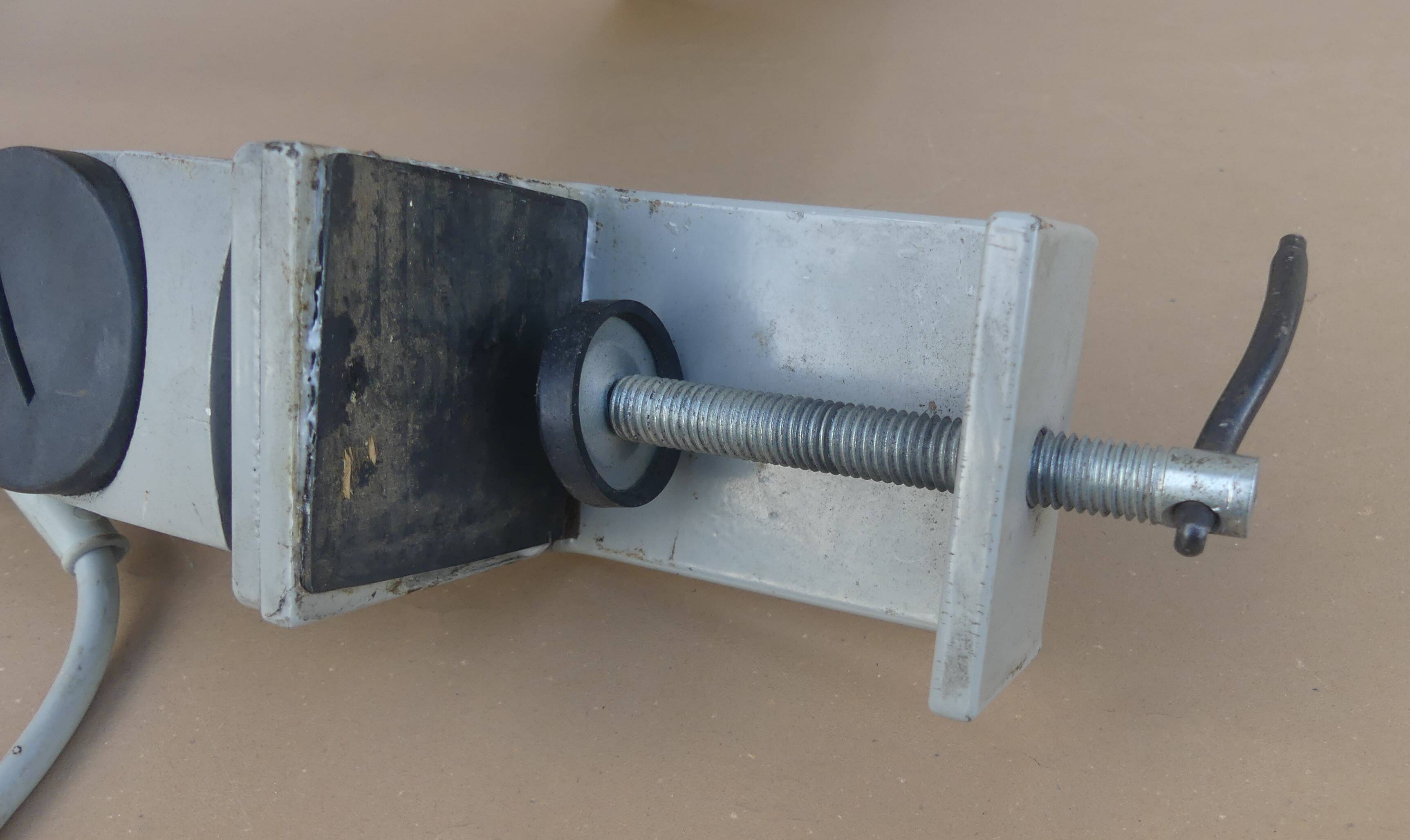 WALDMANN articulated workshop lamp with two industrial clamp arms for architects.