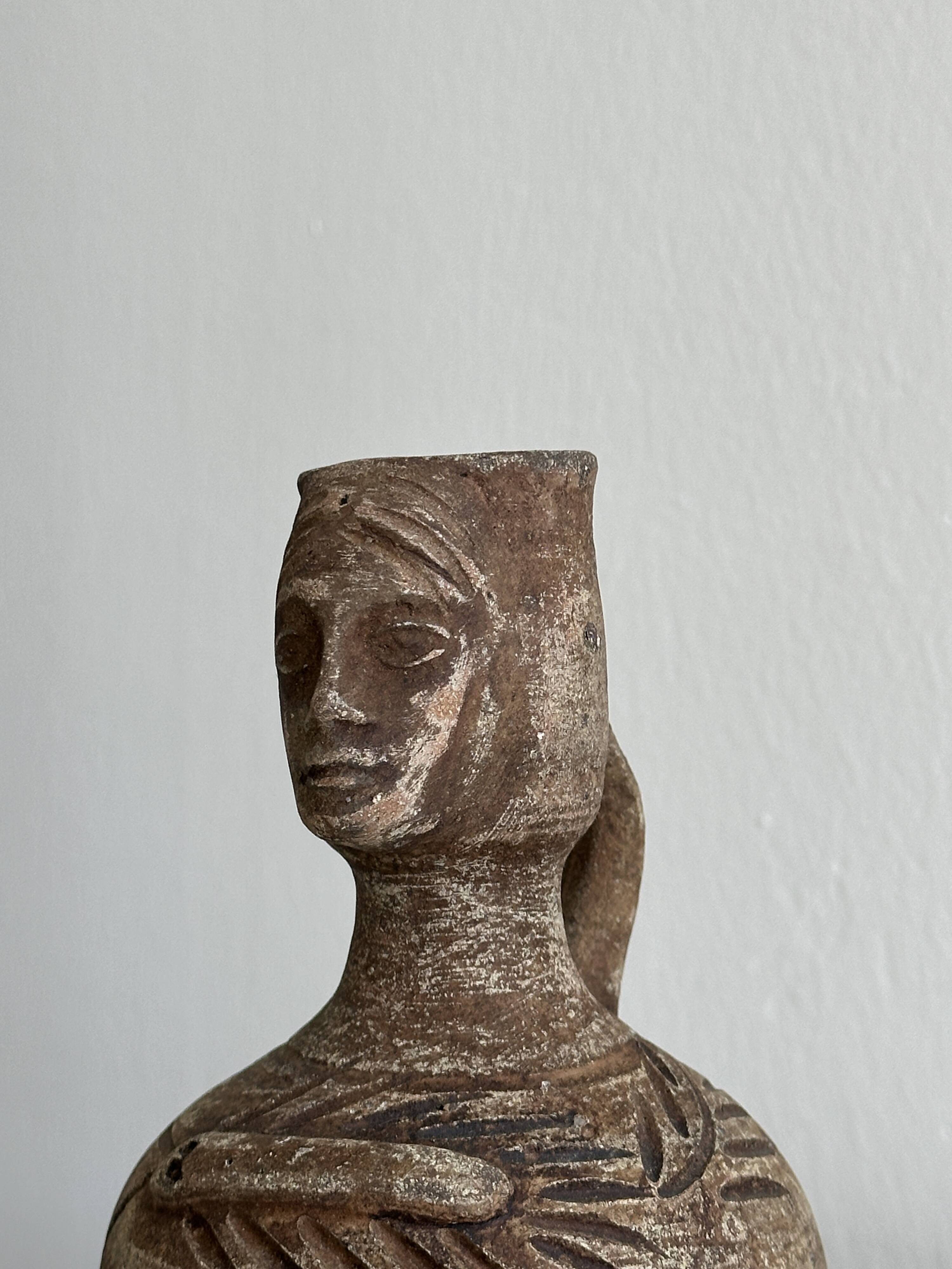 Decorative vase in raw terracotta