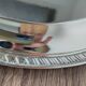 Silver-plated metal dish with a 1980s pattern.