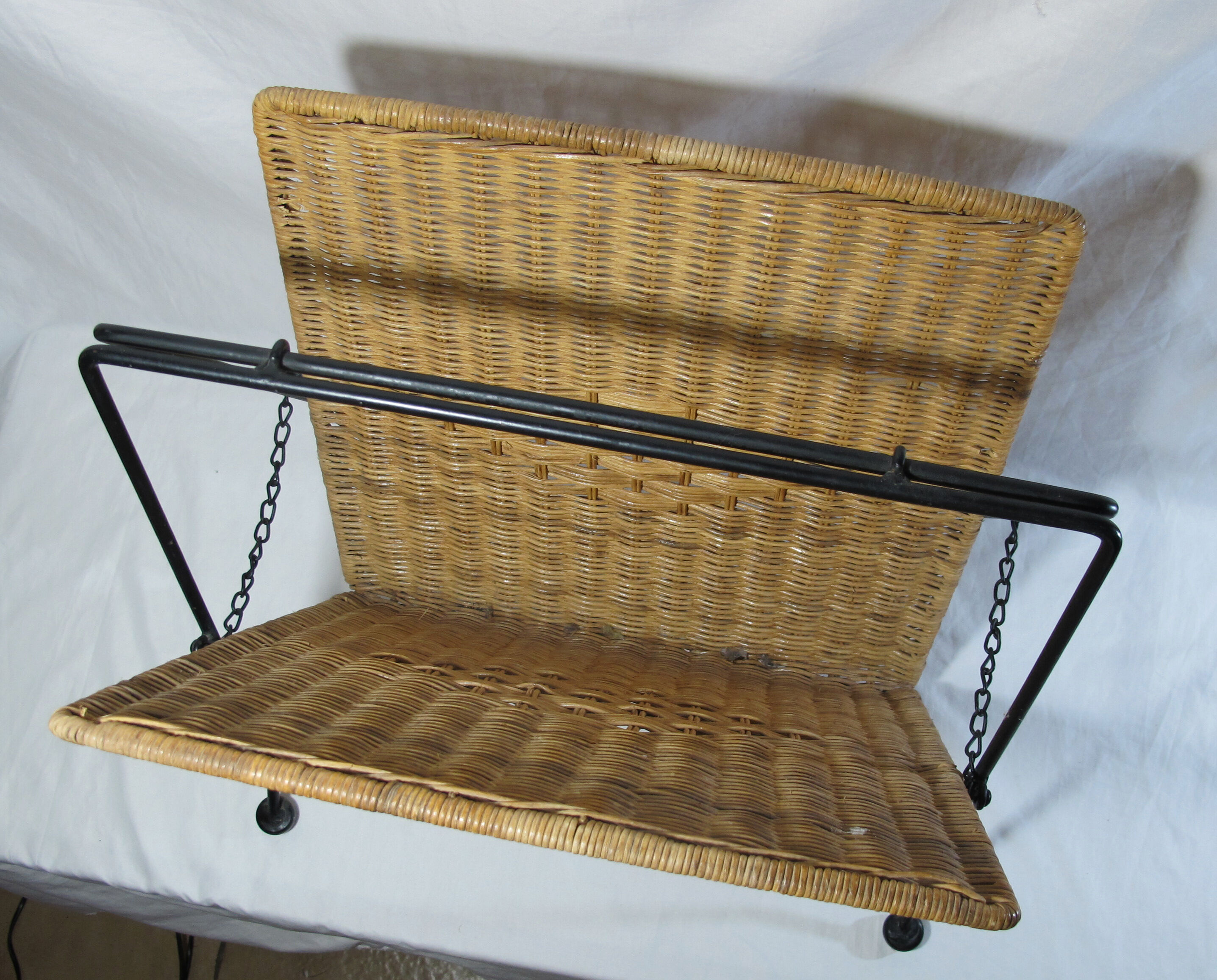 Vintage magazine rack in metal and wicker
