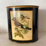 Metal wastebasket with bird decoration