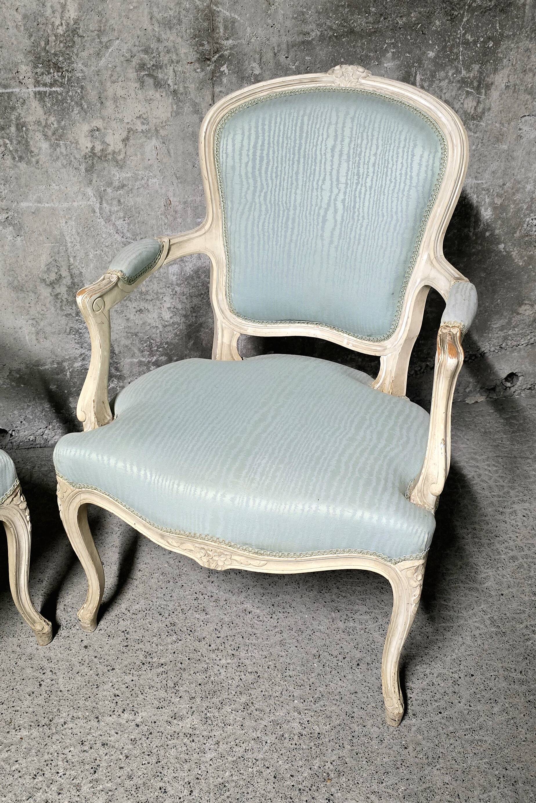 Pair of Louis XV style armchairs in patinated wood, light blue fabric.