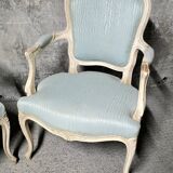 Pair of Louis XV style armchairs in patinated wood, light blue fabric.