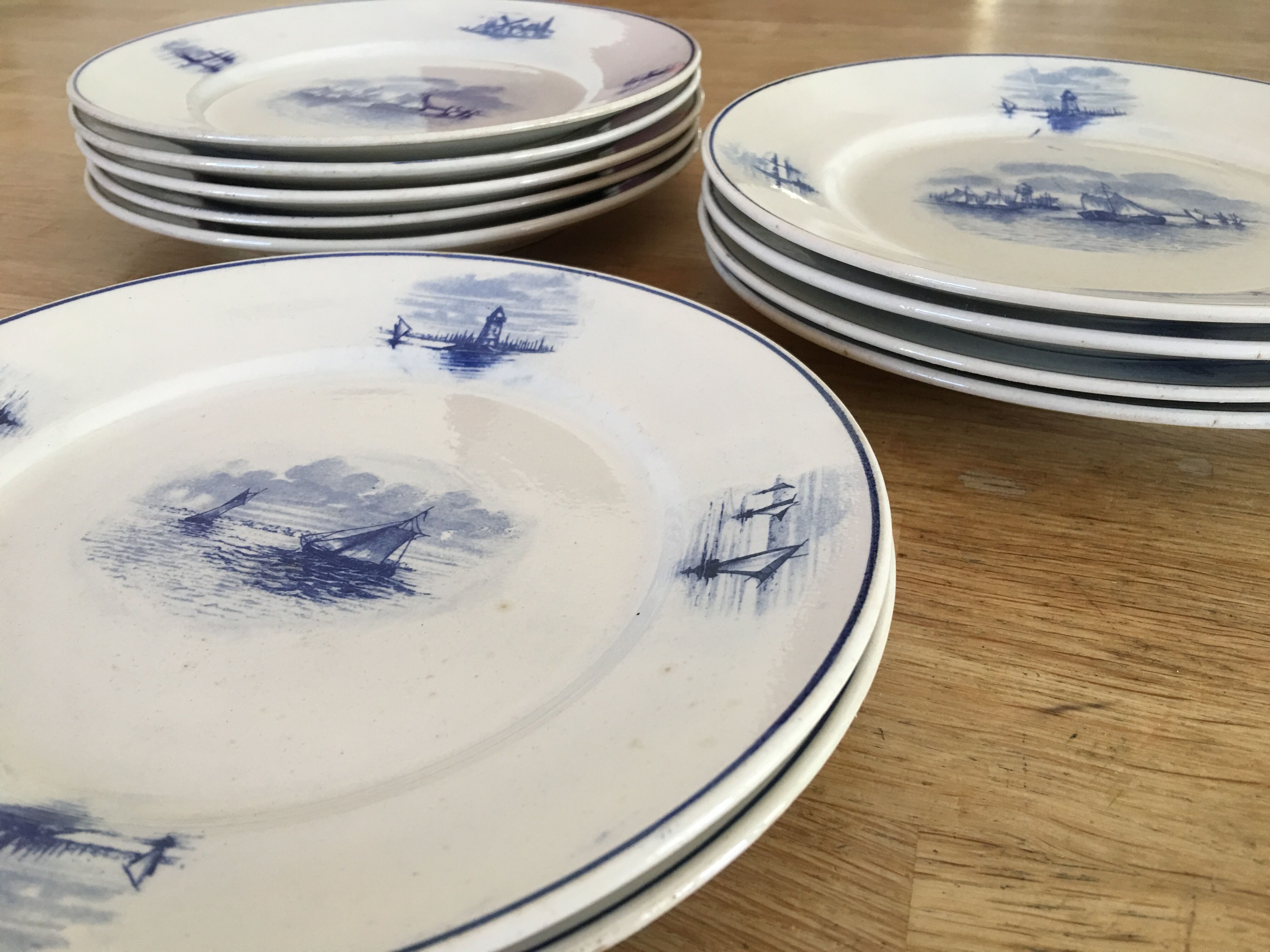 Series of 11 flat plates, Dutch earthenware, early XX