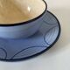 A pair of glazed ceramic cups and saucers from the 60s-70s.